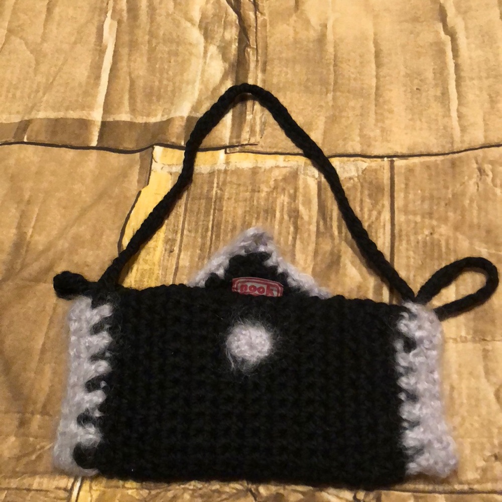 Knitted handmuff bag